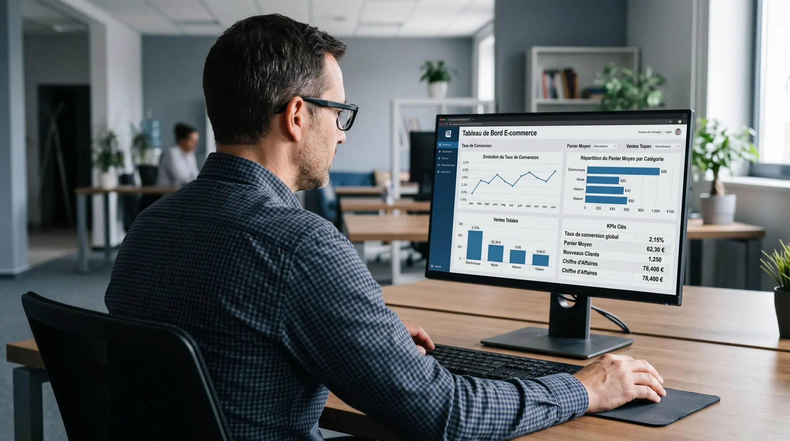 Responsable e-commerce analysant un tableau de bord analytics avec indicateurs de performance et courbes de conversion sur grand écran